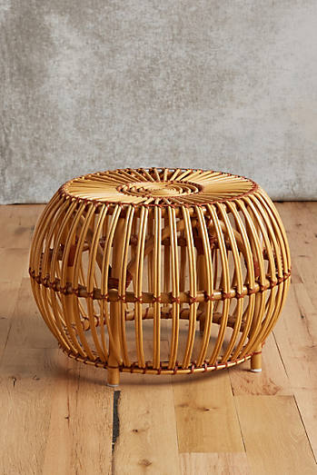 Anthro's Susila Rattan Ottoman $198.00, is pretty and practical, but not significantly MORE so than the Ikea collaboration designs.
